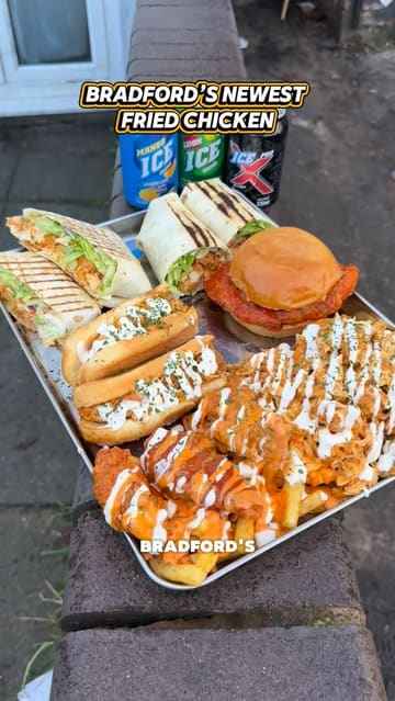 A fast-paced review of a new fried chicken shop in Bradford, featuring a variety of menu items including burgers, wraps, and loaded fries. The creator samples different spice levels and provides feedback on the quality and value of the food.