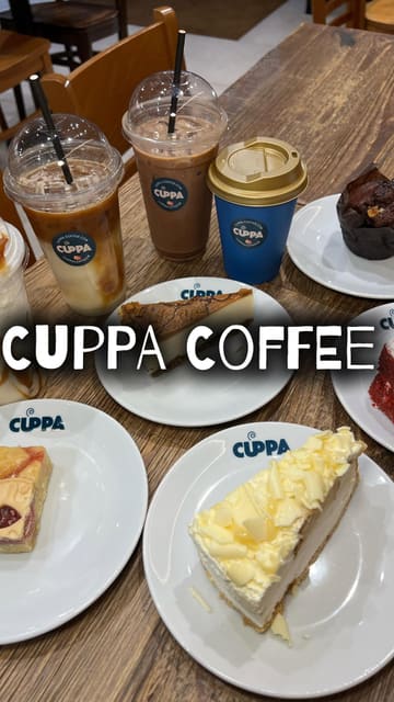 The video features a creator visiting 'Cuppa Coffee' in Bolton. It begins with an outdoor intro, moves inside to show the menu and coffee preparation, and highlights various drinks and cakes available at the venue. The creator provides a personal recommendation, creating a welcoming and informative vibe.