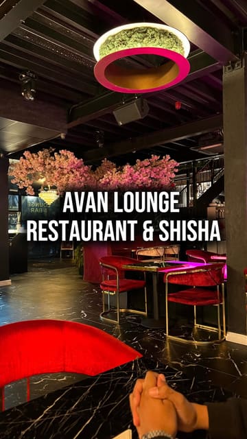 A creator visits Avan Lounge & Bar to review their African cuisine, cocktails, and overall atmosphere. The video features a tour of the venue, including the dining area, games room, and shisha lounge, while highlighting specific dishes like jollof rice and plantain.