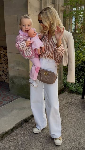 A montage of a family's day out in the Lake District, featuring visits to a cafe, a chocolate shop, a boat ride, and a park. The video focuses on the family's interactions and the scenic surroundings rather than specific venue details.