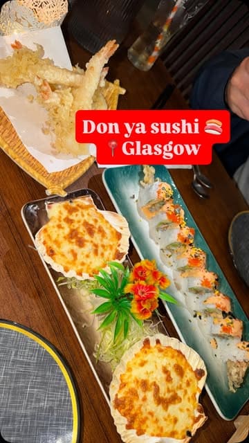 A vlog-style review of a sushi restaurant in Glasgow, showcasing the menu, interior, and various dishes including baked scallops, prawn tempura, and sushi rolls.