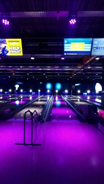 A montage-style video showcasing the various entertainment activities available at King Pins, including bowling, shuffleboard, and digital darts, alongside shots of the pizza served on-site.