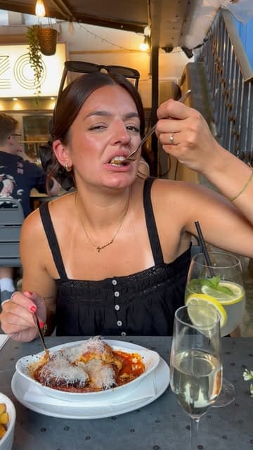A couple reviews their anniversary dinner at Pazzo in Bristol, showcasing the outdoor terrace, various Italian dishes including arancini, mussels, lasagna, and desserts, while providing commentary on the quality and value.