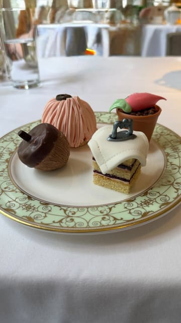 A montage of the Park Room at the Grosvenor House Hotel, featuring the Beatrix Potter themed afternoon tea service. The video highlights the elegant interior, the piano, and the various courses of the tea, including sandwiches, pastries, and scones.