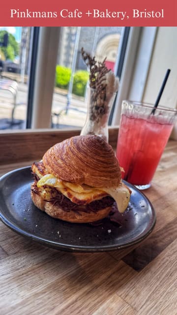 A montage video showcasing the brunch menu, coffee, and baked goods at Pinkmans Cafe + Bakery, highlighting items like the Crobun stack, smoked salmon toast, and their signature sourdoughnuts.