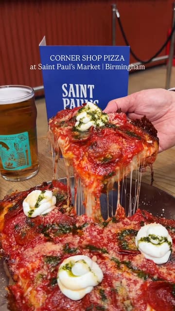 A high-quality food showcase featuring Detroit-style pizza, fried potatoes, fried olives, and beer at Corner Shop Pizza in Saint Paul's Market, Birmingham. The video focuses on close-up shots of the food, including a cheese pull, to highlight the textures and quality of the dishes.