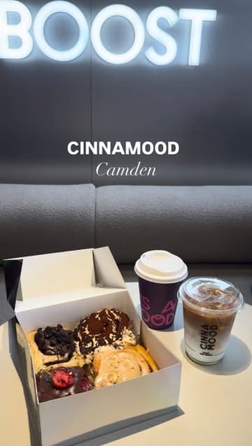 A promotional reel for Cinnamood in Camden, showcasing a wide selection of flavoured cinnamon rolls, matcha drinks, and coffee. The video features close-up shots of the pastries being pulled apart and a quick tour of the shop's interior and merchandise.