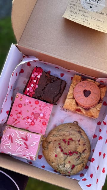 A short video showcasing a Valentine's Day themed baked goods box from a local home baker. The video features the creator opening the box and presenting each of the five items individually on a plate.