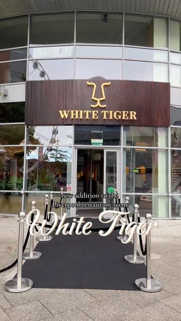 A promotional reel for the launch of White Tiger in Liverpool, featuring shots of the venue's interior, live music, and a variety of canapés and drinks.