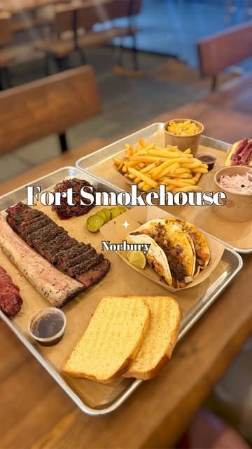 A short, punchy video showcasing a variety of BBQ dishes at Fort Smokehouse in South London, including brisket, beef rib, tacos, and sides.