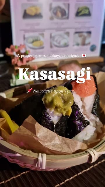 A short, energetic reel showcasing a Japanese Izakaya pop-up experience in Newcastle. The video features close-ups of various Japanese dishes like onigiri, yakitori, and miso-glazed aubergine, interspersed with shots of the creator and the menu.