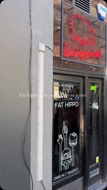 A short, music-synced montage showcasing new menu items at Fat Hippo, including burgers, loaded tater tots, corn, and coleslaw.
