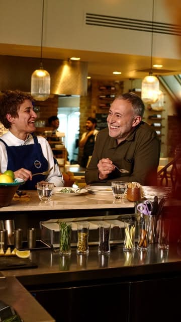 Michel Roux Jr. takes viewers on a curated tour of his favorite London food spots, including La Fromagerie, Miel bakery, Sabor, and Trinity. The video features high-quality cinematography, interviews with the chefs, and close-ups of the food, providing an insider's look at the city's culinary scene.
