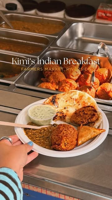 A creator visits Kimi's Indian Catering, a long-standing food stall at the Riverside Farmers' Market in Cardiff, to review their affordable and authentic Indian breakfast.
