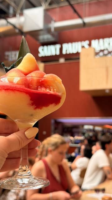 A fast-paced montage showcasing various food and drink vendors at Saint Paul's Market, highlighting the diverse range of cuisines and the lively atmosphere.