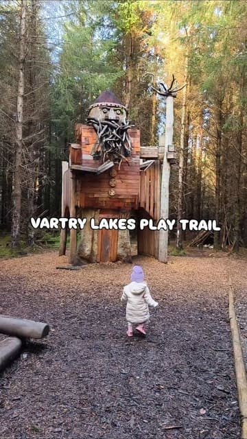 A short video showcasing the Vartry Lakes Play Trail, highlighting the 1.8km loop walk and the various playgrounds along the route, with a recommendation to grab a coffee from Roundwood Stores.