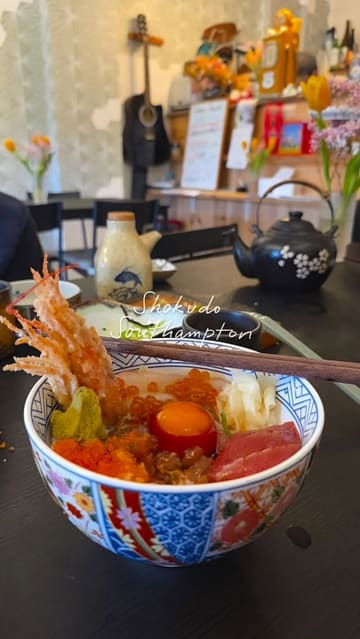 A montage of various Japanese dishes served at Shokudo Southampton, including donburi, gyoza, and karaage. The video focuses on close-up shots of the food presentation, set to music with the venue name overlaid on each clip.