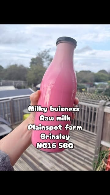 A vlog-style video showing a visit to a farm to purchase raw milk from a vending machine. The creator demonstrates the process of selecting flavors and dispensing the milk, followed by a tour of the farm animals, including goats and cows.