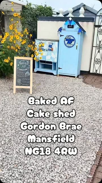 A vlog-style review of a self-service 'cake shed' in Mansfield, showcasing the variety of loaded cookies, brownies, and cheesecakes available.