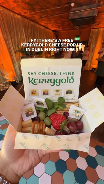 A short, fast-paced video showcasing a Kerrygold cheese pop-up event in Dublin. The video features the exterior of the venue, the interior setup, the complimentary cheese boxes being handed out, and a photo booth experience, effectively highlighting the event's offerings.