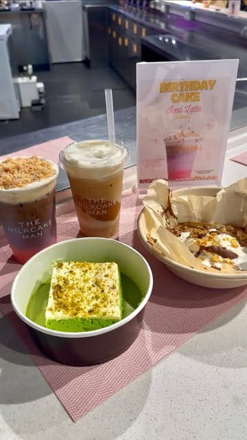 A short, fast-paced promotional video showcasing the menu at The MilkCake Man stall in Selfridges, featuring their birthday iced latte, cookie dough, matcha drinks, and milk cakes.