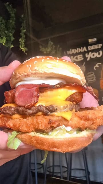 A food review video featuring a visit to Good Burgers in Earlestown. The creator showcases various menu items including triple smash burgers, loaded fries, BBQ chicken tenders, milkshakes, and desserts, providing a taste test and commentary on the quality and portion sizes.