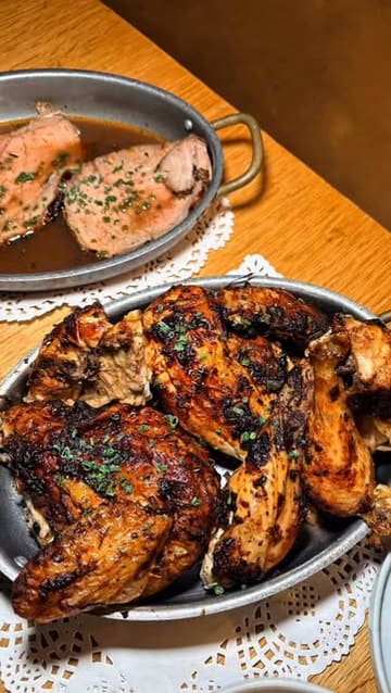 A food review video showcasing a Sunday roast at Le Coq Boutique in Manchester's Northern Quarter, featuring roast chicken, beef, potatoes, and a Basque cheesecake.