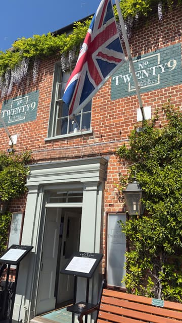 A montage-style video showcasing the interior and exterior of No. Twenty9 in Burnham Market. The video highlights the restaurant's decor, outdoor courtyard, menu, and a meal of fish and chips.