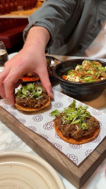 A montage video showcasing a variety of small plates and the interior of a restaurant called Bacchus, highlighting the food presentation and the atmosphere.
