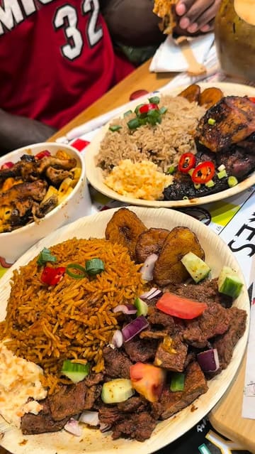 A lively review of 'Jerk vs Suya' in West Norwood, featuring a taste test of various dishes including jerk chicken, suya, and loaded fries. The video highlights the restaurant's vibrant interior, which includes arcade games and board games, and provides a positive assessment of the food quality.