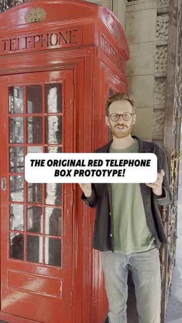 A creator provides a historical tour of the Royal Academy in London, specifically focusing on the original K2 red telephone box prototype located in the entrance.