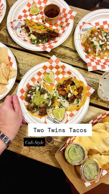 A short, upbeat montage showcasing a visit to Two Twins Tacos, featuring various taco options, chips with guacamole, and margaritas.
