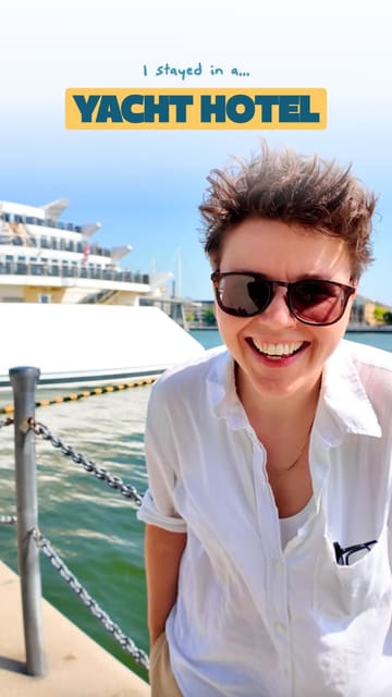 A travel vlog reviewing the Sunborn London Yacht Hotel, highlighting the unique experience of staying on a yacht in London and demonstrating how to use the Vio app to find better hotel prices.