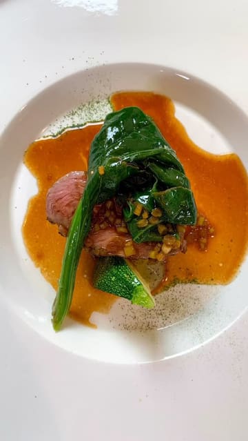 A series of high-quality, static shots showcasing a multi-course tasting menu at a fine dining restaurant. The video focuses entirely on the presentation of the dishes, highlighting intricate plating and artistic food styling.