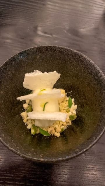 A montage of dishes and scenes from a Michelin-starred Indian restaurant, featuring close-ups of plated food, a bottle of vintage champagne, and the chef in the kitchen.