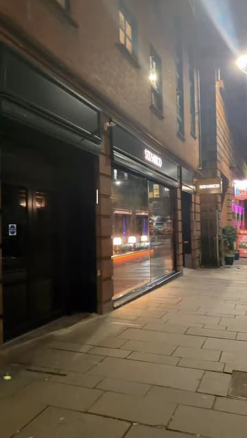 A detailed review of the 'Best of Six' 10-course tasting menu at Six By Nico, featuring close-up shots of each course, the menu, and the drinks, accompanied by a voiceover commentary on the flavours and textures.