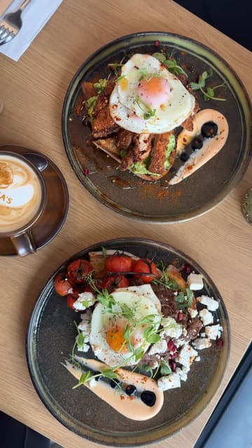 A short, energetic review of Medina's Coffee in Glasgow, featuring two creators trying various brunch dishes including pulled beef on sourdough and a hot honey chicken stack, alongside coffee and desserts.