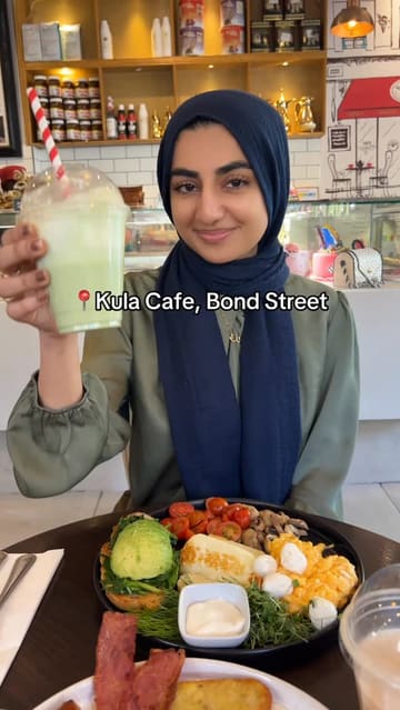 A review of Kula Cafe in London, featuring a variety of brunch options including a full English and a vegetarian breakfast. The creator highlights the halal menu, the quality of the food, and the service, while noting some inconsistencies between the menu photos and the actual presentation.