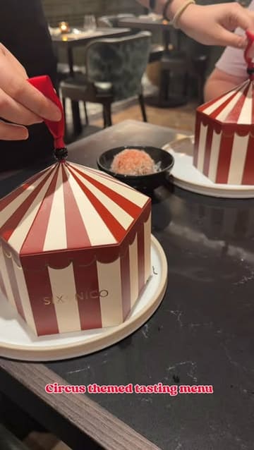 A short, energetic reel showcasing a circus-themed tasting menu at Six by Nico. The video features the creator enjoying various courses, cocktails, and the overall atmosphere of the restaurant, highlighting the theatrical presentation of the food.