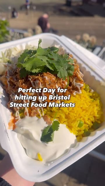A short video showcasing a visit to the KC Peri Peri street food stall at Temple Quay Market in Bristol, highlighting the customizable chicken and rice dish being prepared and enjoyed by the water.