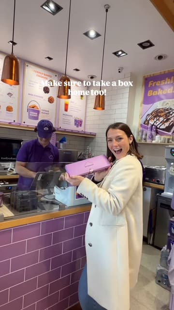 A short, energetic video showcasing a visit to MyCookieDough in Bath. The creator highlights the shop's interior, the variety of cookie dough and cookie options, the ice cream pairings, and the available merchandise. The video uses quick cuts and text overlays to guide the viewer through the experience.