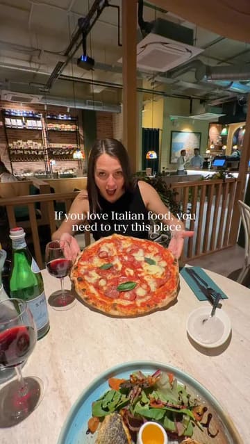 A promotional reel for an Italian restaurant in Bath, featuring a montage of pizza, pasta, cocktails, and desserts, showcasing the interior and dining experience.