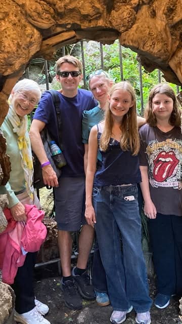 A montage video showcasing a family-friendly visit to Leeds Castle, highlighting the sculpture trail, bird of prey show, mini-golf, maze, grotto, and miniature train ride.
