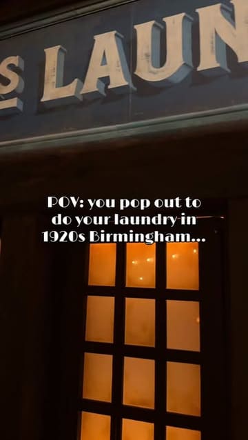 A POV-style video showing a walk-through of a 1920s-themed launderette set that serves as a secret entrance to a Peaky Blinders-themed bar and immersive experience in London.