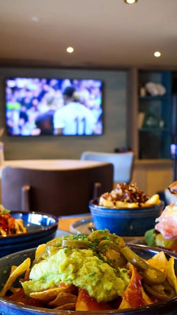 A montage showcasing the facilities at Hoburne Cotswold Holiday Park, including the restaurant, soft play area, lake views, and swimming pool.