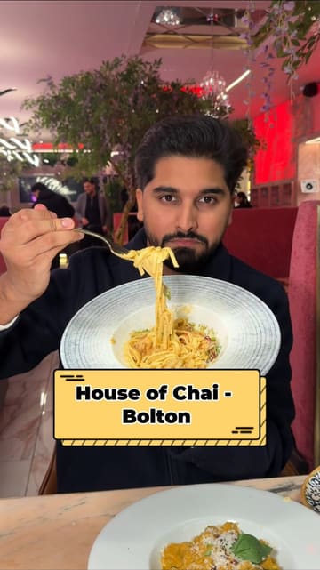 A promotional video showcasing a budget-friendly three-course meal offer at House of Chai in Bolton. The creator highlights the variety of options available for starters, mains, and desserts, while providing a tour of the venue's interior and demonstrating the food presentation.