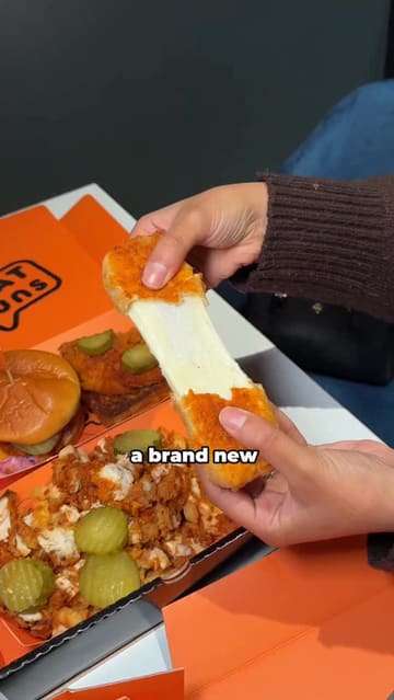 A fast-paced review of a new takeaway venue in Preston called Phat Buns, highlighting their 'munchboxes' which include a variety of items like burgers, loaded fries, mozzarella sticks, and brisket. The creator showcases the food, the menu, and the venue's interior.