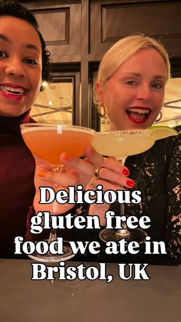 A vlog-style reel featuring two creators exploring various gluten-free dining spots in Bristol, including a dim sum restaurant, a fried chicken and waffle spot, a taco stand, and a donut shop.