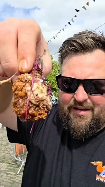 A fast-paced, handheld-style video showcasing the Bristol Wing Fest event. The reel features a variety of chicken wing dishes from different vendors, shots of the venue, and the creator enjoying the atmosphere and food. It highlights the event's energy, the diverse food options, and the live entertainment.