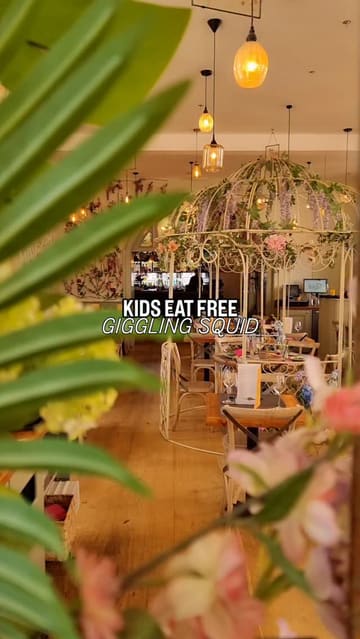 A family-focused vlog showcasing a visit to Giggling Squid, highlighting the 'kids eat free' promotion. The video features shots of the restaurant interior, the mother enjoying a cocktail, and the children trying various Thai dishes.